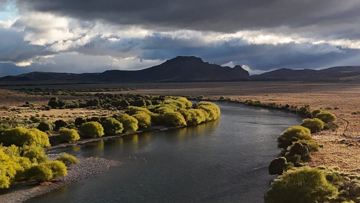 Río Limay with golden light and dramatic clouds
